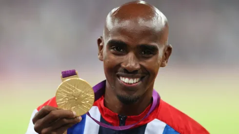 Gold medalist Mohamed Farah of Great Britain poses on the podium during the medal ceremony for the Men's 5000m on Day 15 of the London 2012 Olympic Games at Olympic Stadium on August 11, 2012 in London, England.
