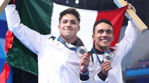 Silver Medalists Juan Manuel Celaya Hernandez and Osmar Olvera Ibarra of Team Mexico pose following the Diving medal ceremony after the Men's Synchronised 3m Springboard Final on day seven of the Olympic Games Paris 2024 at Aquatics Centre on August 02, 2024 in Paris, France.

