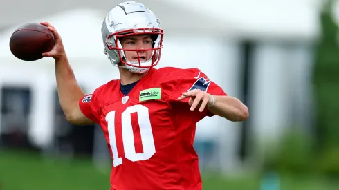 Drake Maye #10 of the New England Patriots makes a pass during the New England Patriots OTA Offseason Workout on May 29, 2024 in Foxborough, Massachusetts.