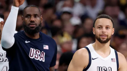LeBron James #6 and Stephen Curry #4 of Team United States look on during a Men's Group Phase – Group C game between the United States and South Sudan on day five of the Olympic Games Paris 2024 at Stade Pierre Mauroy on July 31, 2024 in Lille, France.

