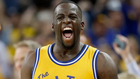 Draymond Green #23 of the Golden State Warriors reacts after making a three-point basket in overtime against the Atlanta Hawks at ORACLE Arena on March 1, 2016 in Oakland, California.
