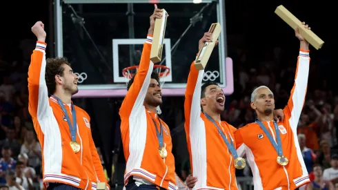 Men's 3&#215;3 basketball Gold medalists Jan Driessen, Dimeo van der Horst, Arvin Slagter, and Worthy de Jong of Team Netherlands celebrate during the medal ceremony for Men's 3&#215;3 basketball.
