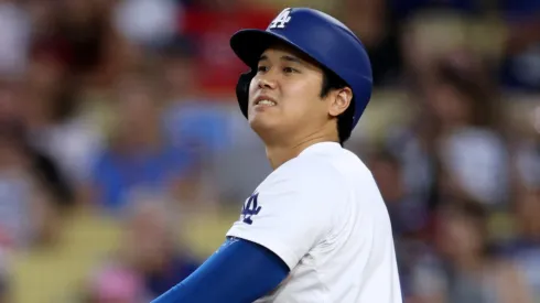 Shohei Ohtani #17 of the Los Angeles Dodgers reacts to his sly out during the third inning against the Philadelphia Phillies at Dodger Stadium on August 06, 2024 in Los Angeles, California.