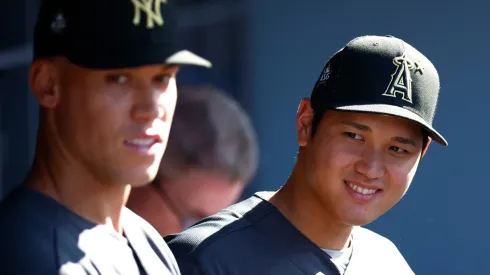 Aaron Judge #99 of the New York Yankees and Shohei Ohtani #17 of the Los Angeles Angels look on from the dugout before the 92nd MLB All-Star Game presented by Mastercard at Dodger Stadium on July 19, 2022 in Los Angeles, California.
