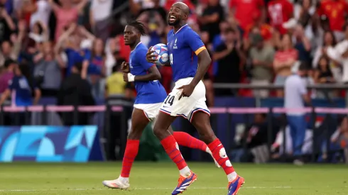 Jean-Philippe Mateta #14 of Team France celebrates scoring his team's third goal via penalty during the Men's Gold Medal match between France and Spain 
