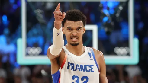 Victor Wembanyama #32 of Team France reacts after a play during a Men's basketball semifinals match between Team France and Team Germany on day thirteen of the Olympic Games Paris 2024 at Bercy Arena on August 08, 2024 in Paris, France.
