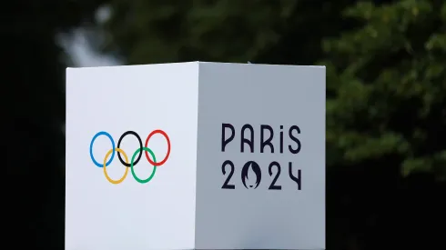 A detailed view of the Paris 2024 Olympics logo on a podium during an Equestrian Eventing training session