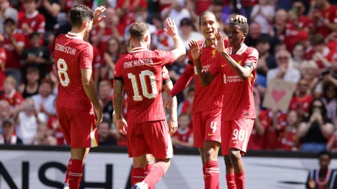 Liverpool's Trey Nyoni (R) celebrates scoring the 4th goal against Sevilla with his team mates during the Pre-Season Friendly between Liverpool and Sevilla