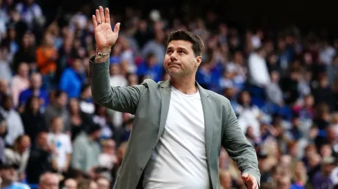 Mauricio Pochettino greets fans during a game
