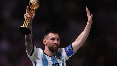 Lionel Messi of Argentina poses with the adidas Golden Ball trophy
