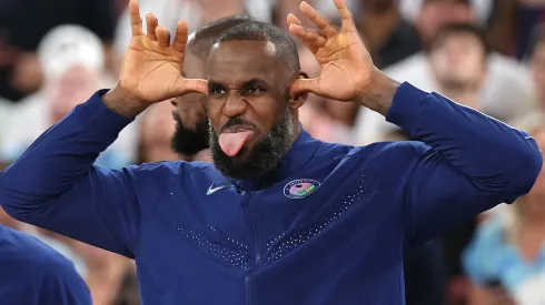 Gold medalist LeBron James of Team United States celebrates on the podium during the Men's basketball medal ceremony on day fifteen of the Olympic Games Paris 2024 at Bercy Arena on August 10, 2024 in Paris, France.