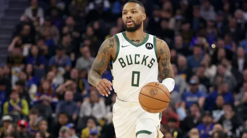 Damian Lillard #0 of the Milwaukee Bucks dribbles the ball against the Golden State Warriors