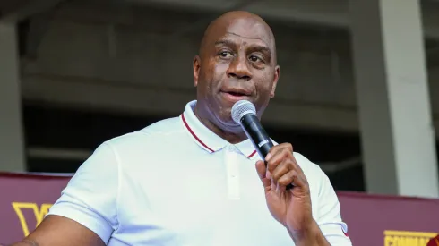 Earvin 'Magic' Johnson, a new owner of the Washington Commanders, delivers remarks during a press conference introducing the team's new ownership.