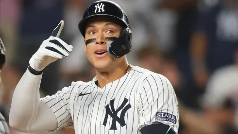 Aaron Judge #99 of the New York Yankees celebrates after hitting a sixth inning home run against the Colorado Rockies at Yankee Stadium on August 23, 2024 in New York City.