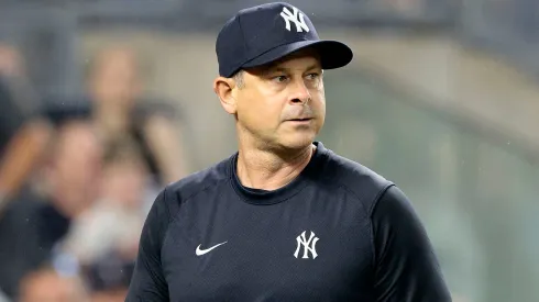 Aaron Boone #17 of the New York Yankees walks back to the dugout after being ejected in the top of the seventh inning during the game against the Atlanta Braves.