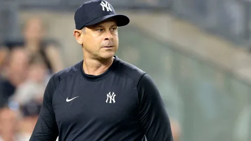 Aaron Boone #17 of the New York Yankees walks back to the dugout after being ejected in the top of the seventh inning during the game against the Atlanta Braves.
