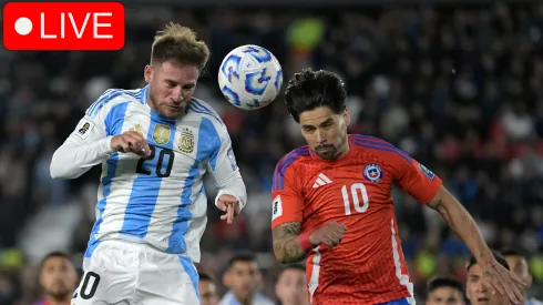 Alexis Mac Allister of Argentina heads for the ball with Víctor Dávila of Chile during the FIFA World Cup 2026 Qualifier match 
