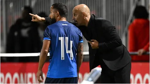 Jason Coronel of Nicaragua with coach Marco Antonio Figueroa
