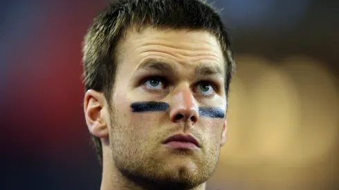 Tom Brady #12 of of the New England Patriots waits on the field before taking on the New York Giants during Super Bowl XLII on February 3, 2008 at the University of Phoenix Stadium in Glendale, Arizona.
