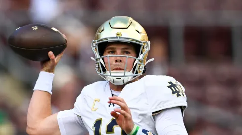 COLLEGE STATION, TEXAS – AUGUST 31: Riley Leonard #13 of the Notre Dame Fighting Irish warms up prior to the game against the Texas A&M Aggies at Kyle Field. 
