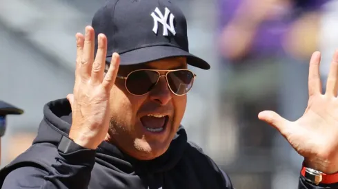 Aaron Boone #17 of the New York Yankees argues with home plate umpire Hunter Wendelstedt #21 in the first inning during the game against the Oakland Athletics at Yankee Stadium.