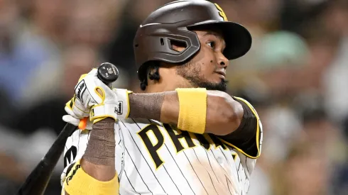 Luis Arraez #4 of the San Diego Padres hits a double in the eighth inning against the Pittsburgh Pirates.
