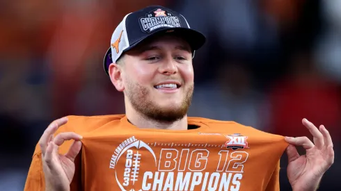 Quarterback Quinn Ewers of the Texas Longhorns celebrates after Texas defeated the Oklahoma State Cowboys in the Big 12 Championship at AT&T Stadium on December 2, 2023 in Arlington, Texas. 
