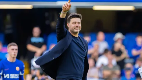 Mauricio Pochettino greets fans during a game
