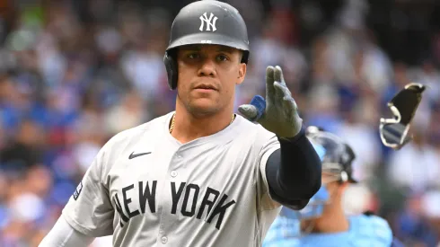 Juan Soto #22 of the New York Yankees throws his shades during the first inning of a game against the Chicago Cubs at Wrigley Field on September 06, 2024 in Chicago, Illinois.
