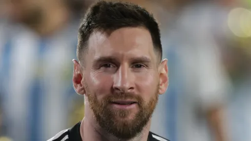 Lionel Messi of Argentina smiles with the FIFA World Cup trophy during the World Champions' celebrations
