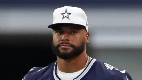 Dak Prescott #4 of the Dallas Cowboys looks on from the sideline during the first half of a preseason game against the Los Angeles Chargers at AT&T Stadium on August 24, 2024 in Arlington, Texas. 
