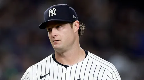 Gerrit Cole #45 of the New York Yankees reacts on the mound after giving up a walk to Francisco Alvarez of the New York Mets in the sixth inning at Yankee Stadium on July 24, 2024 in New York City. 
