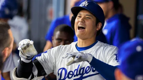 Shohei Ohtani 17 of the Los Angeles Dodgers is congratulated in the dugout after hitting his 47th home run in the first inning during their MLB, Baseball Herren, USA regular season game against the Chicago Cubs.
