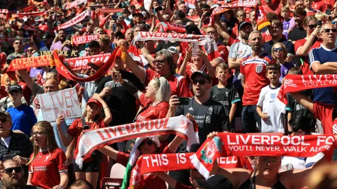  Liverpool fans raise their scarves
