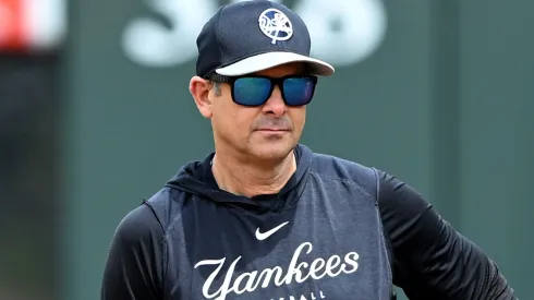 Manager Aaron Boone #17 of the New York Yankees watches batting practice before the game against the Baltimore Orioles at Oriole Park .
