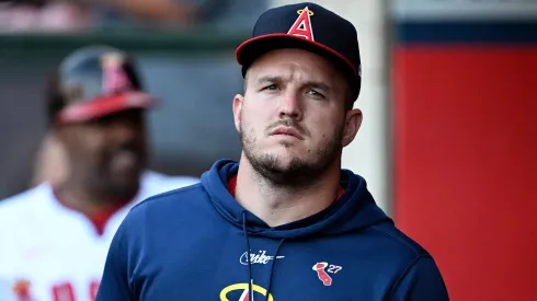 Mike Trout #27 of the Los Angeles Angels looks on from the dugout during the first inning against the Colorado Rockies at Angel Stadium of Anaheim.
