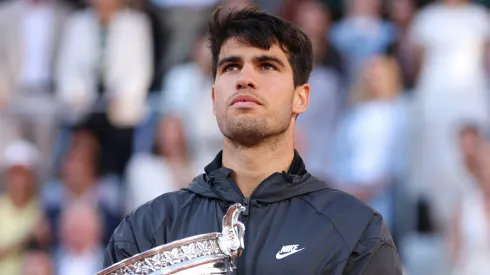 Carlos Alcaraz of Spain celebrates with the winners trophy after victory in the Men's Singles Final match between Alexander Zverev of Germany and Carlos Alcaraz of Spain on Day 15 of the 2024 French Open at Roland Garros on June 09, 2024 in Paris, France. 
