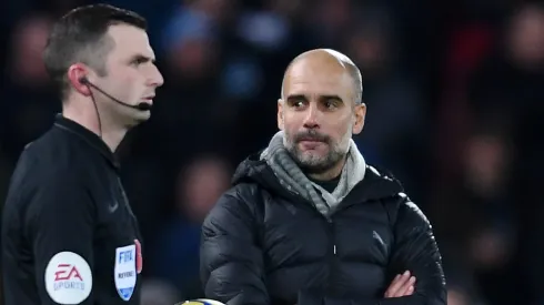 Pep Guardiola, Manager of Manchester City stares at referee Michael Oliver as he walks onto the pitch for the second halfduring the Premier League match between Liverpool FC and Manchester City at Anfield on November 10, 2019 in Liverpool, United Kingdom.