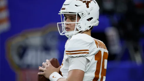 Arch Manning #16 of the Texas Longhorns warms up prior to playing against the Washington Huskies during the CFP Semifinal Allstate Sugar Bowl at Caesars Superdome on January 01, 2024 in New Orleans, Louisiana.