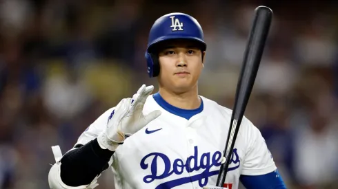 Shohei Ohtani #17 of the Los Angeles Dodgers salutes the San Diego Padres dugout as we walks up to bat during the first inning at Dodger Stadium on September 26, 2024 in Los Angeles, California. 
