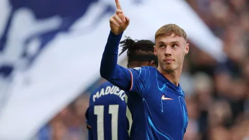 Cole Palmer of Chelsea celebrates scoring his team's third goal and his hat trick during the Premier League match between Chelsea FC and Brighton & Hove Albion FC at Stamford Bridge on September 28, 2024 in London, England.
