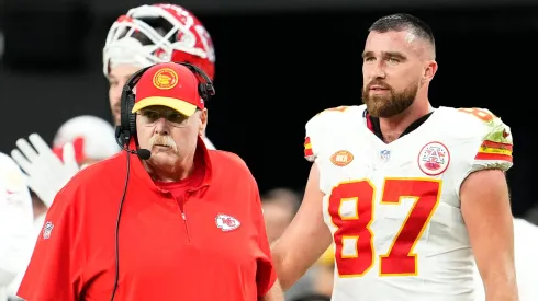 Head coach Andy Reid and Travis Kelce #87 of the Kansas City Chiefs look on during the second quarter of a game against the Las Vegas Raiders at Allegiant Stadium on November 26, 2023 in Las Vegas, Nevada.