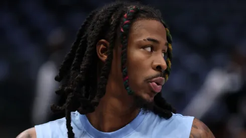 Ja Morant #12 of the Memphis Grizzlies warms up prior to a pre-season game against the Dallas Mavericks at American Airlines Center on October 7, 2024 in Dallas, Texas. 
