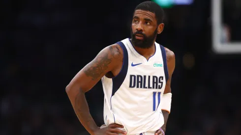 Kyrie Irving #11 of the Dallas Mavericks looks on during the first quarter against the Boston Celtics
