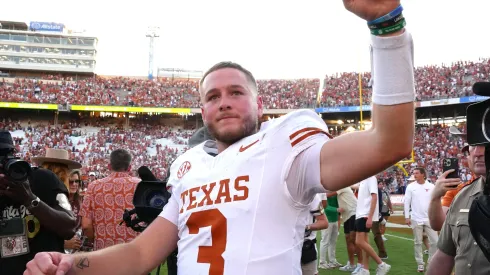 Quinn Ewers #3 of the Texas Longhorns celebrates after defeating the Oklahoma Sooners 34-3 at Cotton Bowl Stadium on October 12, 2024 in Dallas, Texas.
