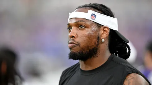 Derrick Henry #22 of the Baltimore Ravens watches the preseason game in the first quarter against the Philadelphia Eagles at M&T Bank Stadium on August 09, 2024 in Baltimore, Maryland.
