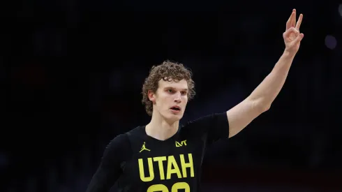 Lauri Markkanen #23 of the Utah Jazz celebrates after scoring a basket against the Washington Wizards
