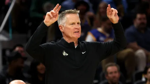 Golden State Warriors head coach Steve Kerr motions to his team during the first half of their preseason game against the Los Angeles Lakers