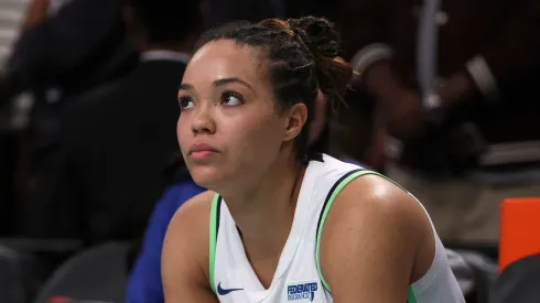 Napheesa Collier #24 of the Minnesota Lynx sits on the bench after she fouled out during the overtime period against the New York Liberty during Game Five of the WNBA Finals
