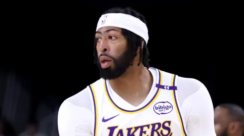 Anthony Davis #3 of the Los Angeles Lakers reacts after a three-point basket during the first quarter against the Phoenix Suns at Acrisure Arena on October 06, 2024 in Palm Springs, California.
